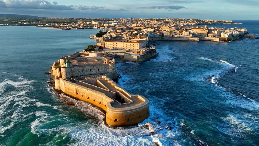 Syracuse in Sicily, Italy, aerial view, flying above Sicilian city of Syracuse at sunset, travel in Sicily, Mediterranean resort town