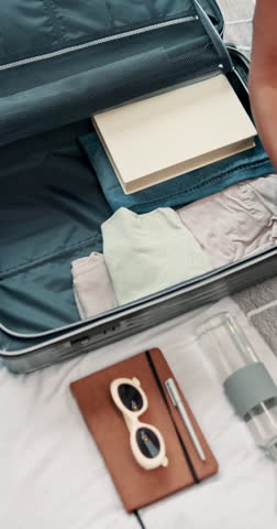 Hands, woman and packing suitcase at house for travel preparation, clothes and organizing of vacation. Above, female person and wardrobe in luggage, hospitality and holiday trip of abroad destination