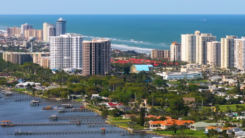 Daytona Beach, Florida. Aerial view of waterfront neighborhood with private homes and high hotel buildings on Atlantic ocean shore in southern USA