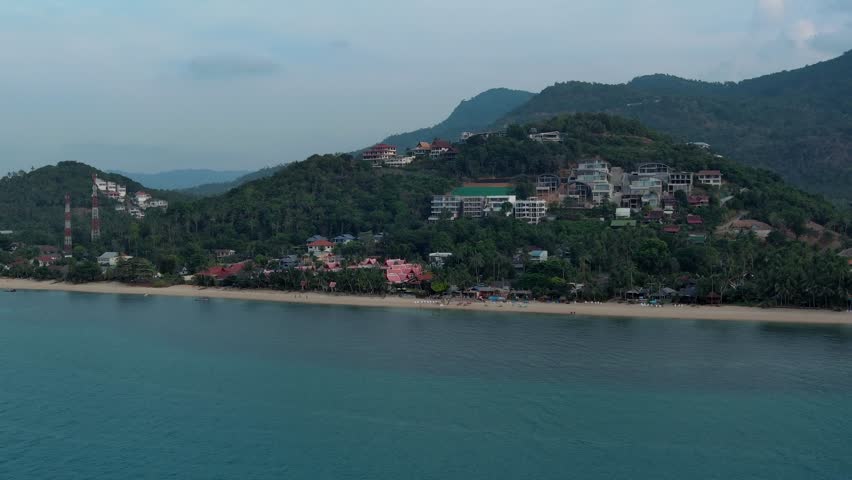 Approaching the north side of Koh Samui Island in Thailand- Aerial drone scene -buldings and temple area