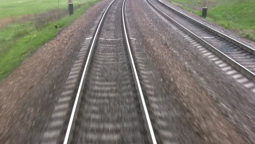 View from the last car of a train. Rails run away. Real sound
