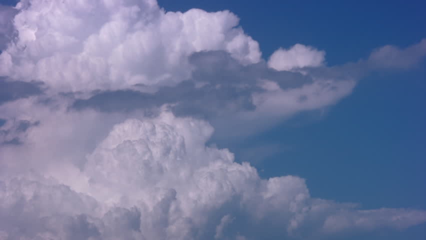 Cumulus clouds on a background of blue sky. Timelapse