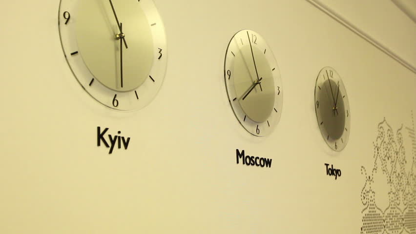 Wall clock showing international time of various world cities