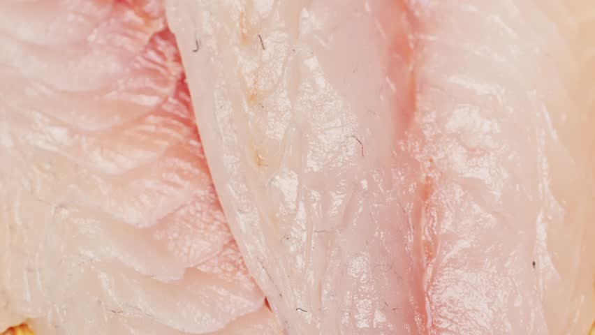 Cooking fish Peruvian ceviche close-up. Fresh cooked ceviche made of raw white fish. Traditional Peruvian cuisine. Cooking seafood dish.