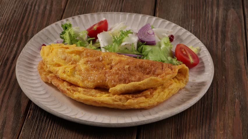 scrambled eggs omelette with salad on plate food