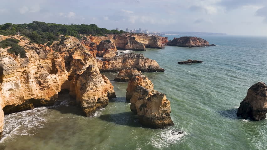 Aerial view of the beach in rocky lagoon near Lagos town, Algarve province, Portugal.