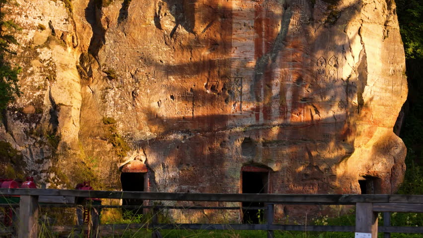 Handcarved Drawings Left By Ancient Inhabitants On The Prehistoric Sandstone Cliffs Of Ligatne, Latvia. Gauja National Park Tours.