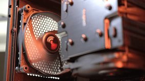 An integral part of the PC, rotating fan in the case. Cooling system. Computer components, hardware, assembly and repair, IT, closeup - Powered by Shutterstock - Get 15% off with code: PIKWIZARD15