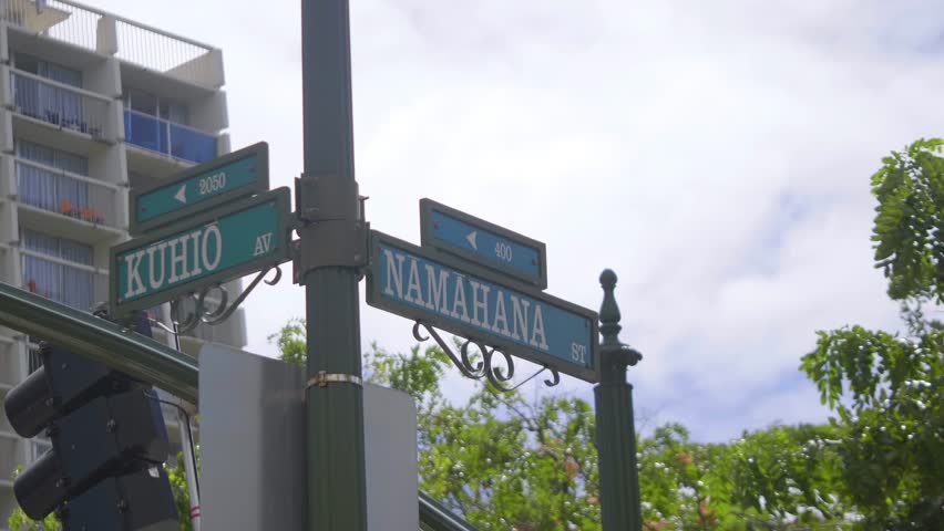 Traffic light and street signs in Honolulu, Hawaii, USA in 4K slow motion 60fps