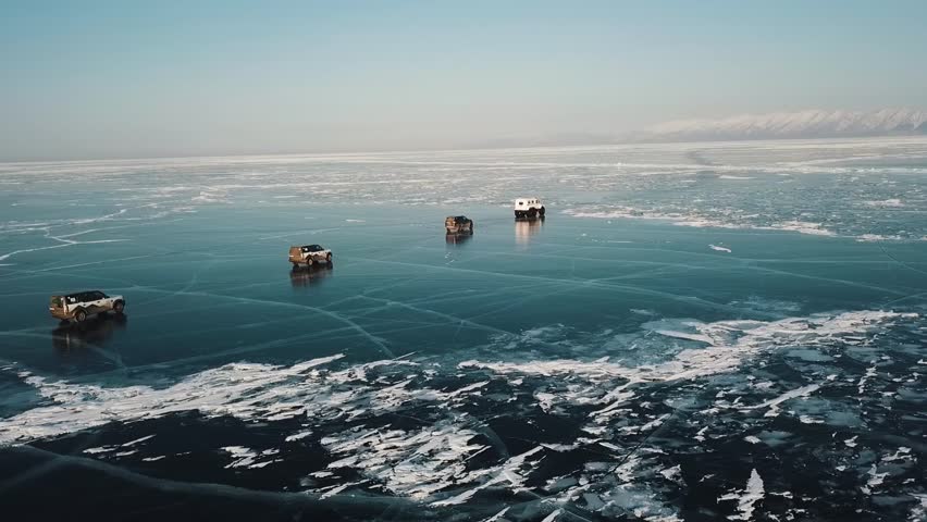 Lake Baikal. cars drive on a frozen lake