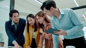 Group of young Asian business people team meeting in modern office working design planning and ideas concept - Powered by Shutterstock - Get 15% off with code: PIKWIZARD15