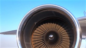 Close-up of a jet engine on an aircraft at an airport with wing and tail. Jet engine turns with wind power.  - Powered by Shutterstock - Get 15% off with code: PIKWIZARD15