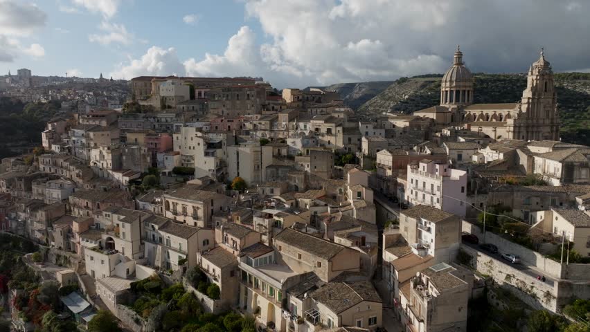 flying above Ragusa town in Sicily, aerial view, drone shot of the town of Ragusa on the island of Sicily in southern Italy, travel in Sicily. High quality 4k footage