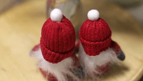 small decorative santa clauses on the table under a spruce pine branch decorate christmas table set for arrival of guests on christmas table set for friends winter table living room for meeting guests - Powered by Shutterstock - Get 15% off with code: PIKWIZARD15