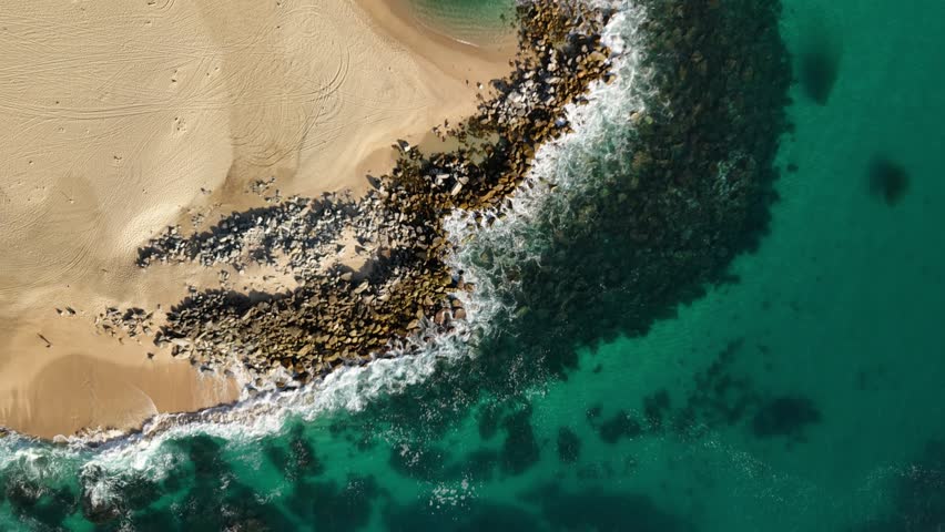 Straight down drone view of a beach in Cabo San Lucas Mexico near San José del Cabo.
