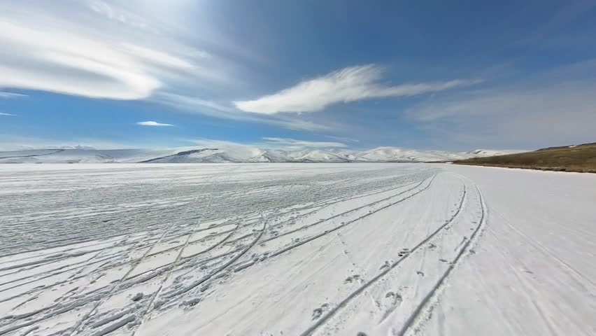 Frozen Cildir Lake, riding with horse carriage