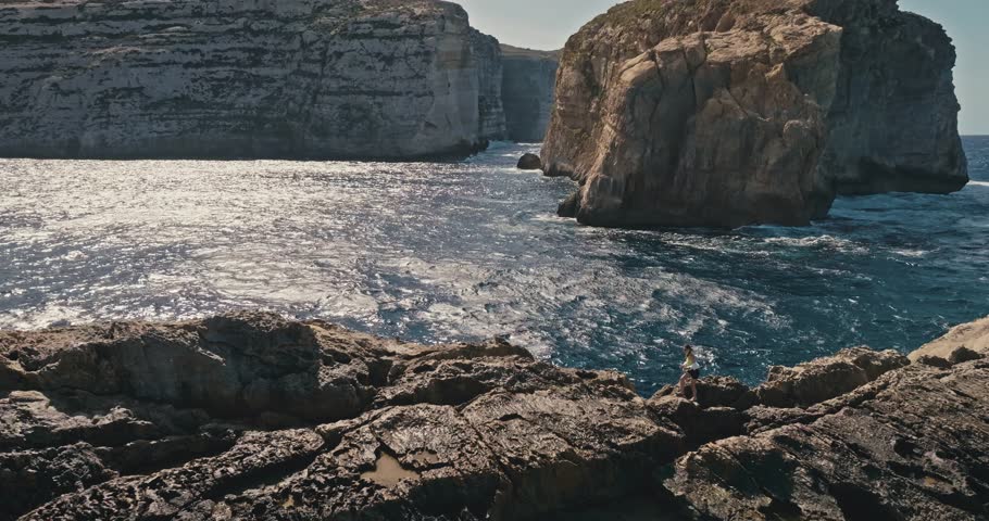 Beautiful Aerial Scene of Fungus Rock in Malta Gozo Island with Striking Ocean Waves and Rocky Shoreline. High quality 4k footage