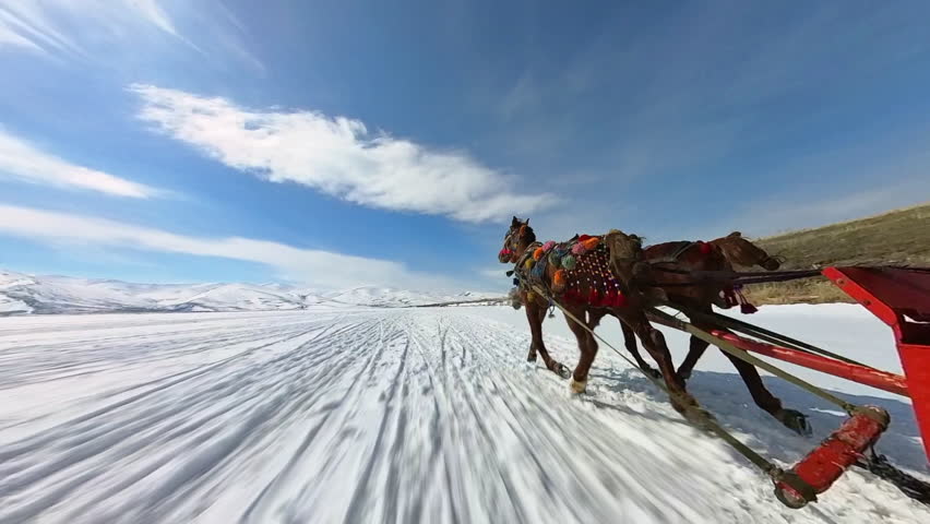 Frozen Cildir Lake, riding with horse carriage