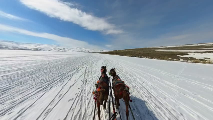 Frozen Cildir Lake, riding with horse carriage
