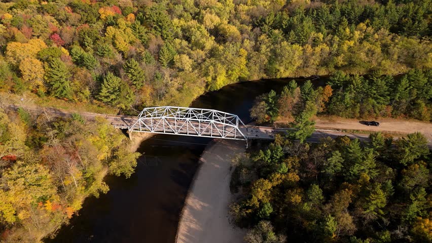 Old steel girder bridge over Eau Claire river in Wisconsin