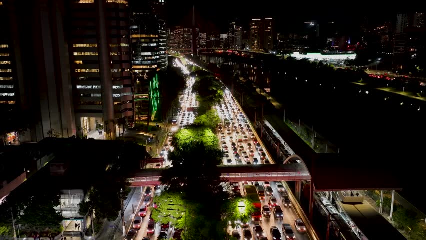 Night Sao Paulo Skyline At Downtown Sao Paulo Brazil. Scenic Time Lapse Of Traffic Vehicles In The Downtown City. Building Metropole Landscape Skyscrapers Stunning. Metropole Skyscrapers.
