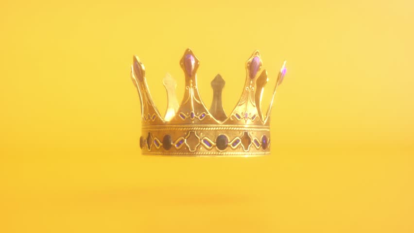 Golden shiny gold crown on bright yellow background. King's Day