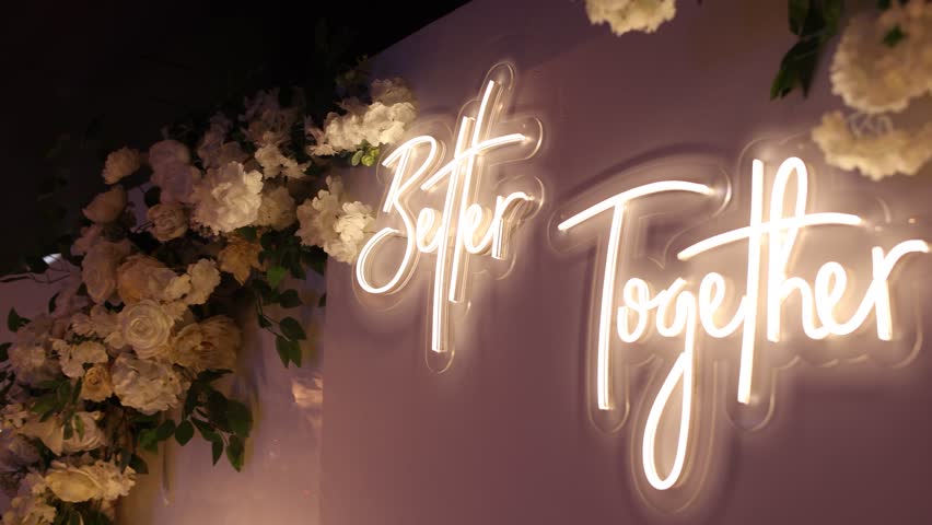  the inscription is better together on the wall of the wedding table in the restaurant
