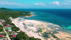 Aerial drone view of tropical coastline of Bohol Island at sunset, Philippines. High quality 4k footage - Powered by Shutterstock - Get 15% off with code: PIKWIZARD15