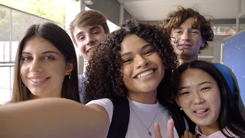 Selfie Perspective of Diverse Teen Students Having Fun in High School