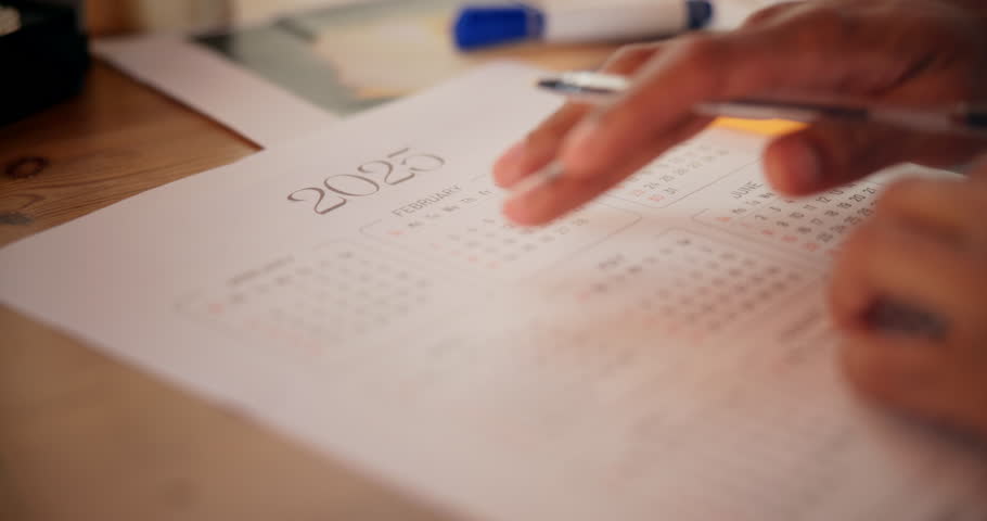 Man, hands and writing on calendar in workplace, plan schedule and reminder for meeting. Male person, professional and paper for information on date, employee efficiency and tasks for organization