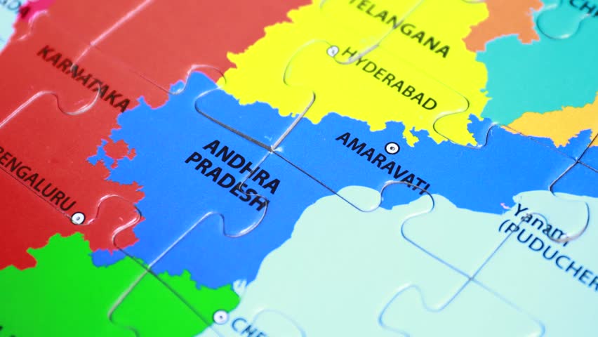 A human hand with a map pin pointing Amaravati - the capital of Andhra ...
