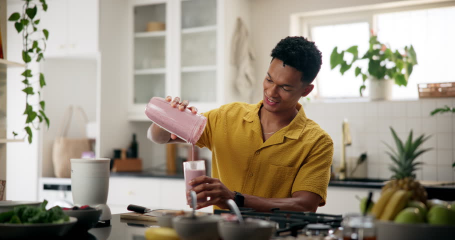 Man, happy and smoothie in kitchen for wellness, nutrition or protein shake for weight loss. Fitness person, supplement drink or smile in home for diet control, healthy body or morning detox for care