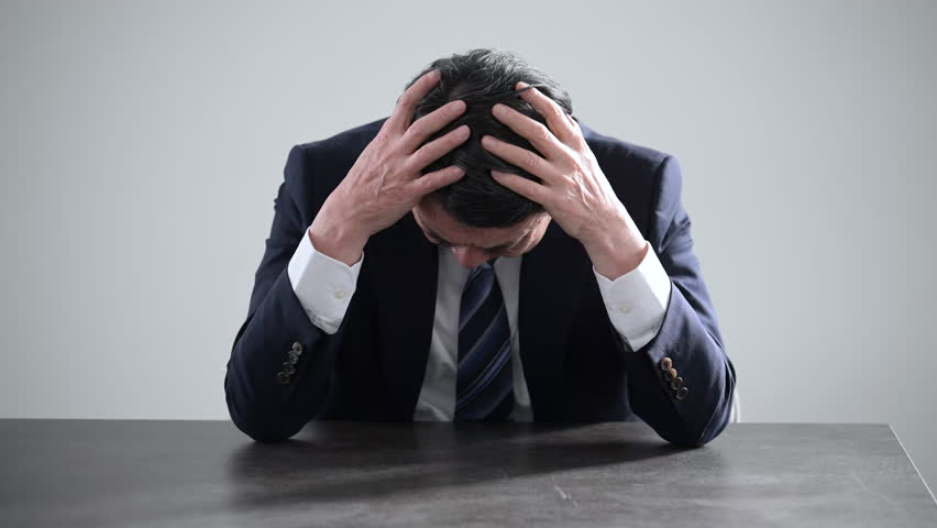 Video of the image of a small business owner struggling to keep his head above water, having trouble with business succession and sales Close-up	