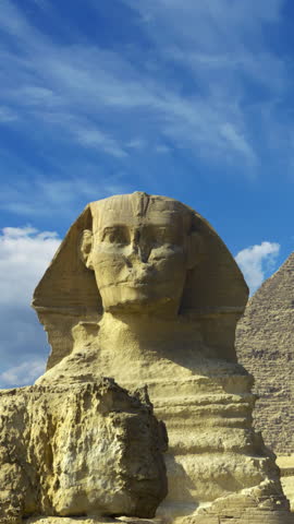 Clouds over great pyramid and sphinx in Egypt - timelapse. Vertical video
