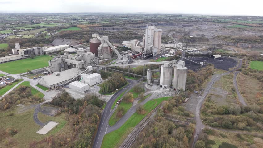 Cement factory with machinery and smokestacks in Limerick, Ireland