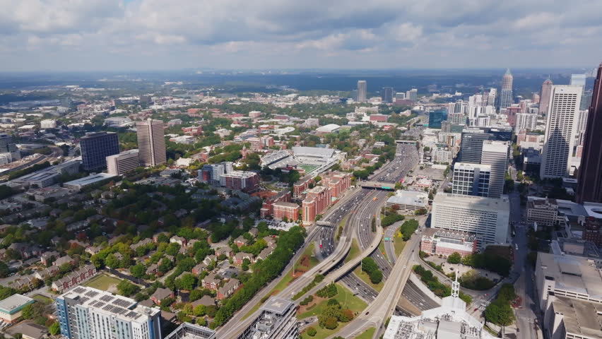 Aerial View Of Cars Driving Through The Highway Along The Midtown Atlanta, Georgia, USA.