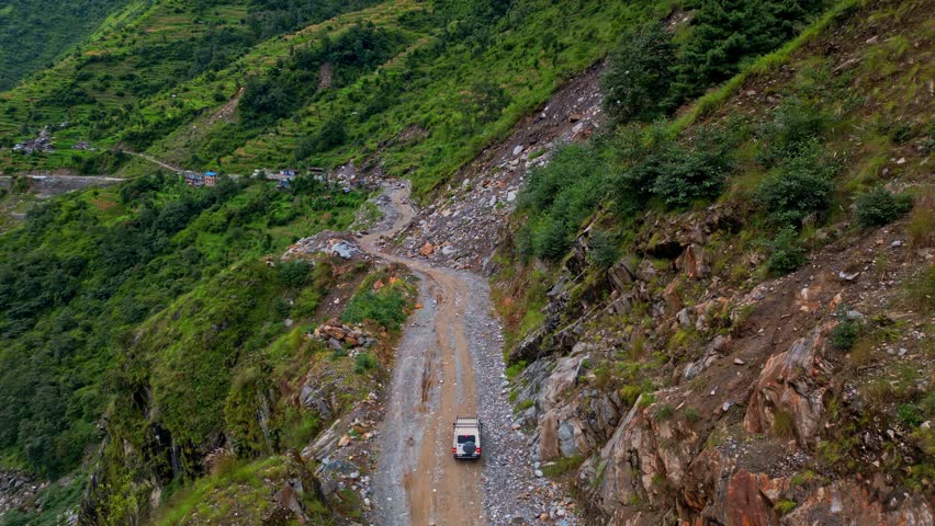 Tourists returning from the Everest Himalaya Mountains after their visit to Pokhara embark on a jeep safari through one of the world's most challenging roads. Beni-Jomsom Highway, Nepal.