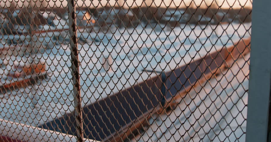 Railway platform in winter. Freight train loaded with shipping containers