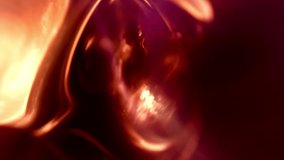 Abstract macro close up red golden fluid wallpaper background loop. Reflecting and transparent glowing lava fluid 3D animation backdrop. Relaxing and satisfying artistic and elegant motion backplate. - Powered by Shutterstock - Get 15% off with code: PIKWIZARD15