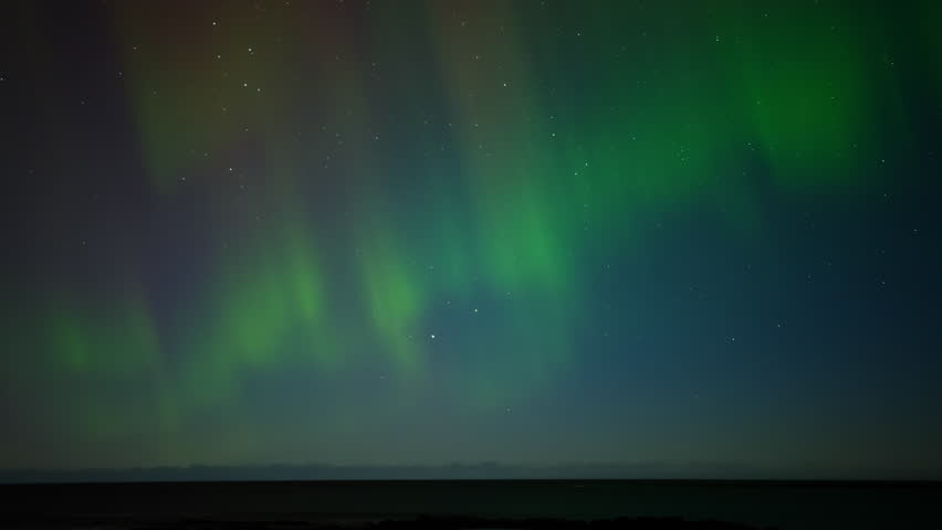 Aurora Borealis, Northern Lights in Iceland, Real Night Sky with Stars Time Lapse, Astronomical Phenomenon, Solar Wind, Earth Electromagnetic Field.