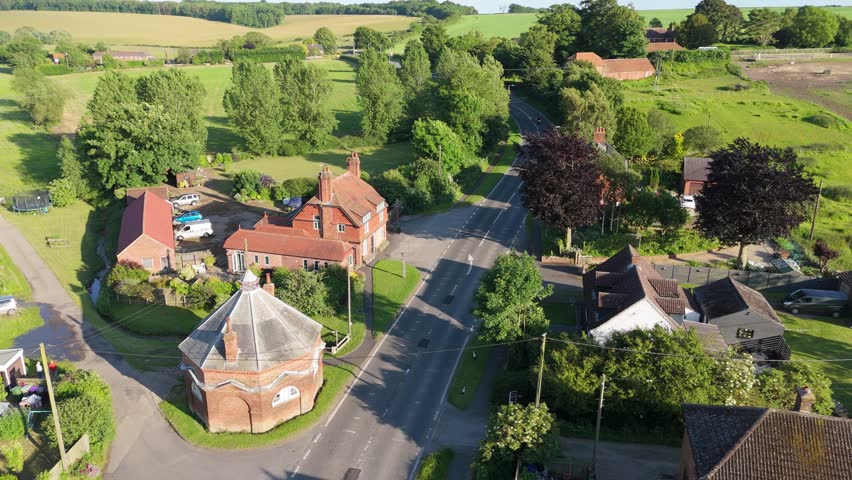 Aerial drone footage of a small Lincolnshire village called Burwell in the UK. Typical English rural village scene. St Michael
