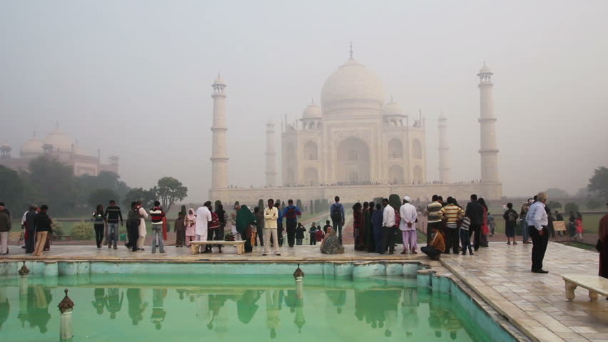AGRA, INDIA - NOVEMBER 17, 2012: tourists in Taj Mahal - famous mausoleum in