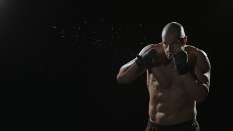 Kickboxer shadow boxing as exercise for the big fight, shot on Red Epic