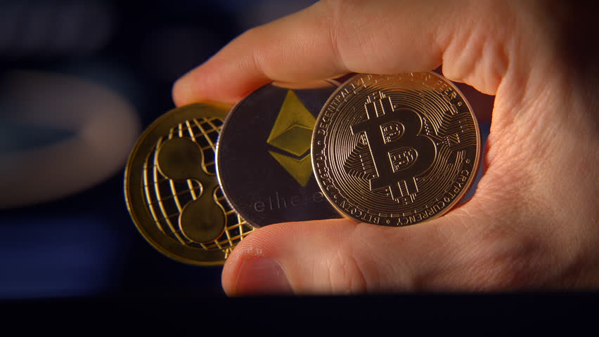 Cryptocurrency The Promising Future of Digital Finance and Innovative Transactions - Holding Bitcoin Ethereum and Ripple XRP Coins