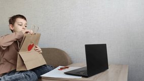 Love and technology on Valentine's Day: teenager gives gift via video link, virtual valentine and greeting, Valentine's Day and children - Powered by Shutterstock - Get 15% off with code: PIKWIZARD15