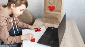 Love and technology on Valentine's Day: teenager gives gift via video link, virtual valentine and greeting, Valentine's Day and children - Powered by Shutterstock - Get 15% off with code: PIKWIZARD15