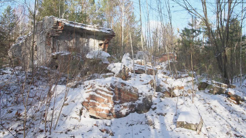 A picturesque snowy landscape with an old abandoned cabin enveloped by the beauty of nature all around