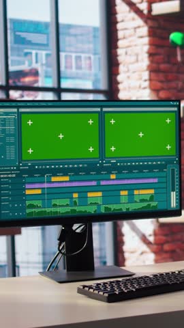 Video editor wearing headphones to polish footage and improve audio quality on green screen PC. Videographer professionally adjusting clips, applying sound effects using chroma key computer, camera A