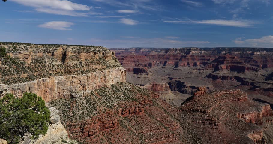 Breathtaking views of the Grand Canyon, Arizona, showcasing its iconic layered rock formations, vast cliffs, and the winding Colorado River.