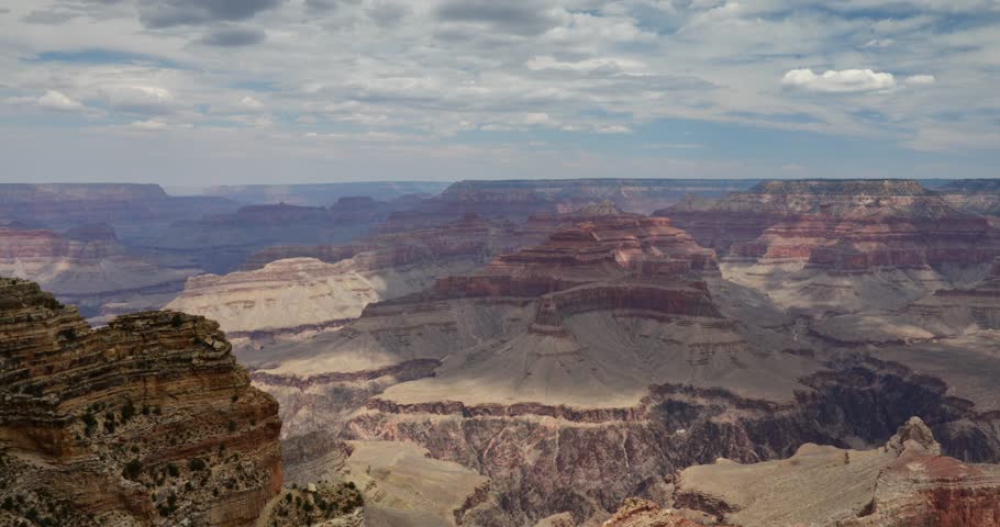 Breathtaking views of the Grand Canyon, Arizona, showcasing its iconic layered rock formations, vast cliffs, and the winding Colorado River.